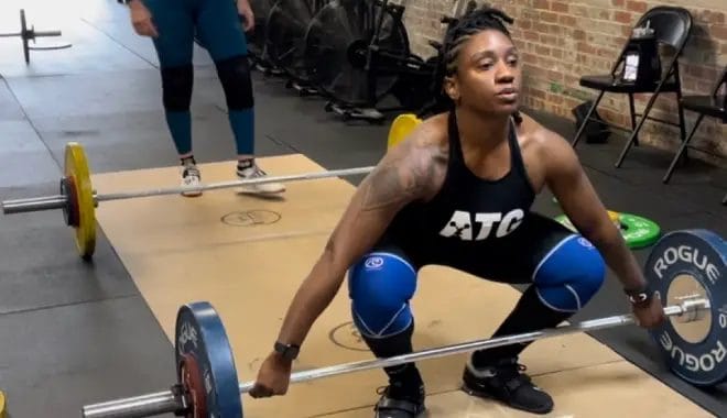 Red Eye CrossFIt Woman Getting Ready to Lift Barbell