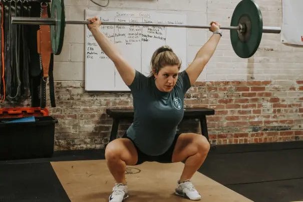 Red Eye CrossFIt Woman with Barbell Overhead